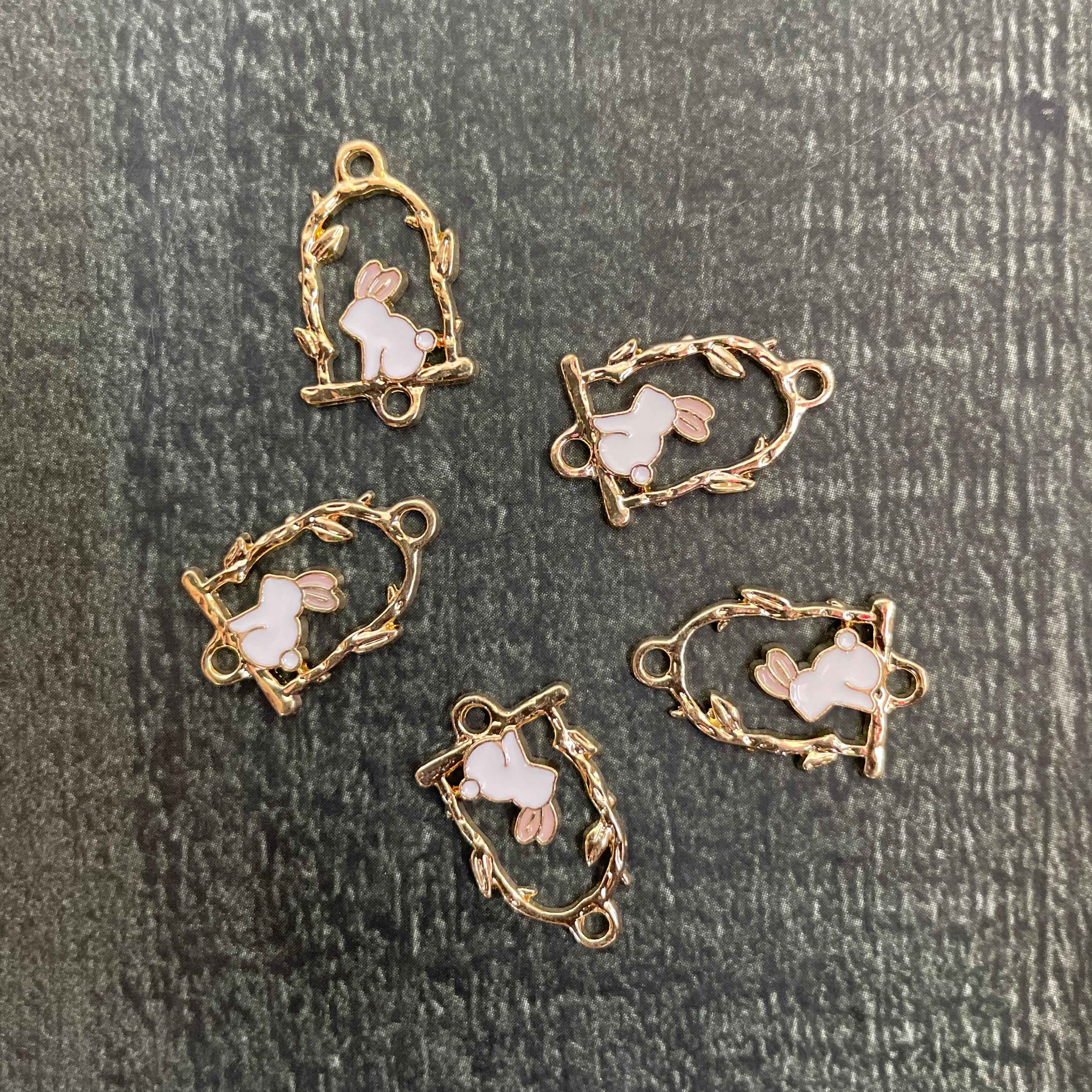 Rabbit seating on swing charm 10 image 0
